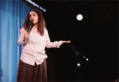 Rachel Kaly with a hand mic in Hospital Hour. Photo by Emilio Madrid