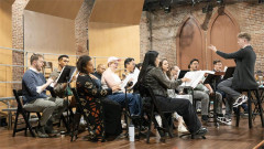 The choir of I Became We in rehearsal at Atlantic Theater Company. Photo by Ahron R. Foster