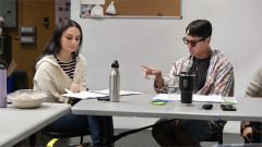 Christine Carmela and John Yi at the rehearsal table. Photo by India Stachyra