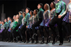 The company of Riverdance 30 – The New Generation in the show's famous line of dancers
