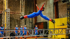 A STREB Extreme Action performer dives across a steel rig in Do Not Try This At Home. Photo by Mikhail Lipyanskiy