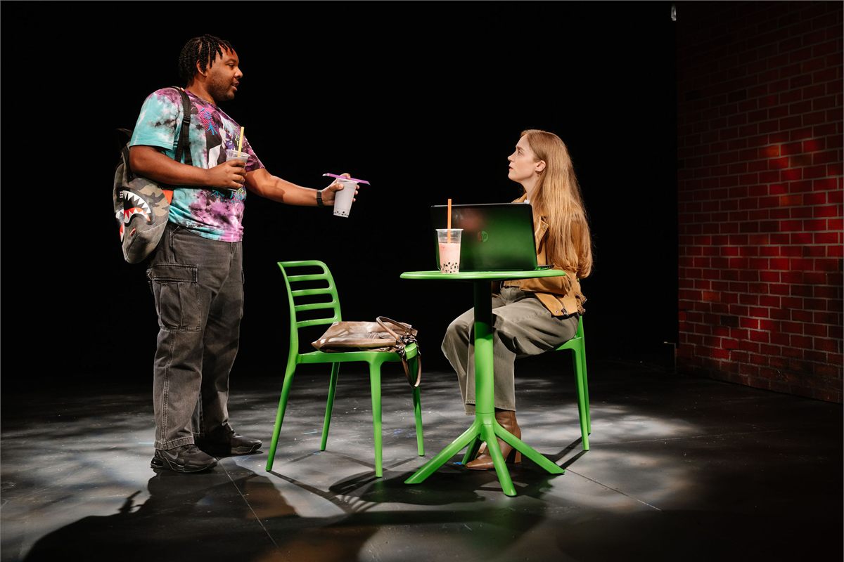 Tyler Nowell Felix and Olivia Rose Barresi at a cafe table in Degenerates at Playwrights Horizons