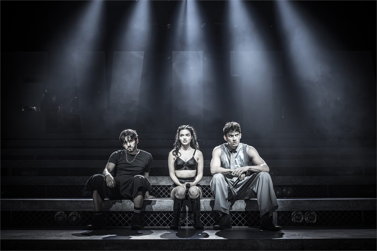 Diego Rodriguez as Che, Rachel Zegler as Eva Perón and James Olivas as Juan Perón in Evita. Photo by Marc Brenner