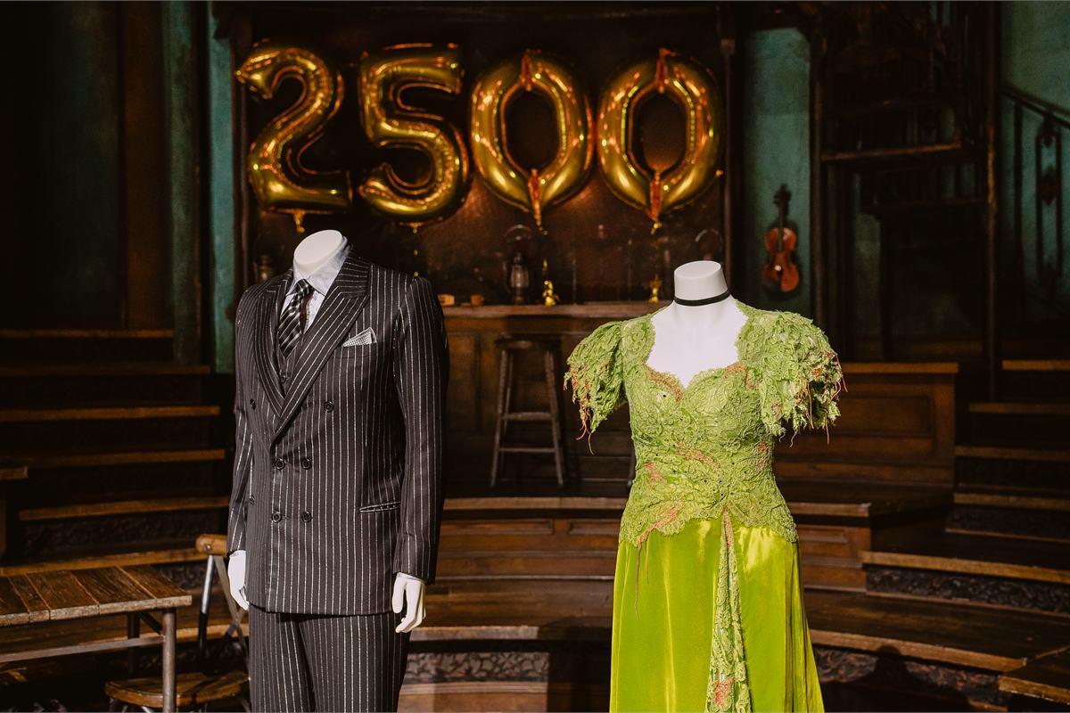 The Hades and Persephone costumes donated to the Smithsonian, on the Hadestown set at the Walter Kerr Theatre. Photo by Michaelah Reynolds