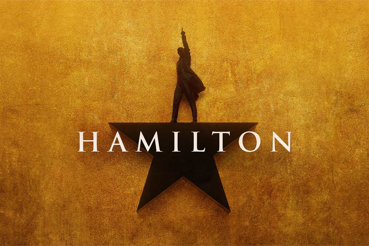 Hamilton key art: a silhouetted Alexander Hamilton standing on the show's black star against a gold background
