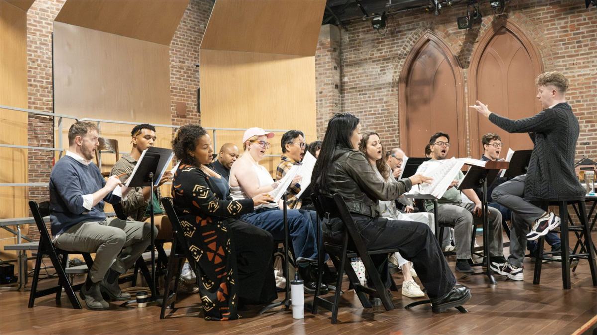 The choir of I Became We in rehearsal at Atlantic Theater Company. Photo by Ahron R. Foster